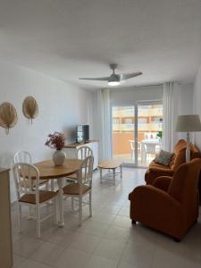 a living room with a table and a couch at Hawaii V 25B - La Manga By WATERMELON in La Manga del Mar Menor +17 photos