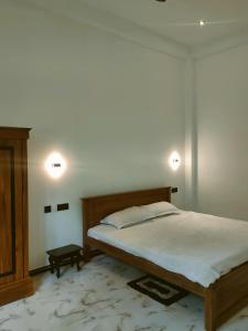 Postel nebo postele na pokoji v ubytování New Wijaya Villa