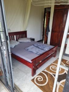 a bedroom with a bed in a tent at sakalaka in Fort Portal