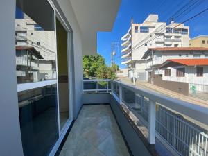 a balcony with a view of a city at B149 - Ampla casa no centro de Bombinhas - SC in Bombinhas