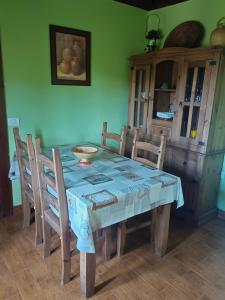 a dining room table with a blue table cloth on it at Casa Rural de Abuelo in Garafía