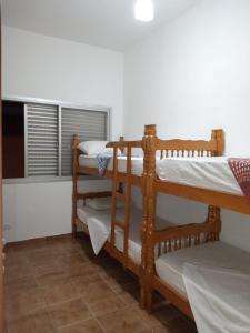 Postel nebo postele na pokoji v ubytování Guarujá Enseada - SAMFBAS - Hospedagens a 200m da Praia + 60 fotografií