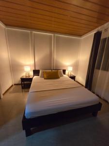 Кровать или кровати в номере Casa kattleya