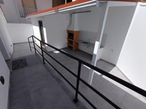 a staircase in a house with a stair railing at Casa do Correio in Pampilhosa da Serra