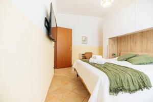 Voodi või voodid majutusasutuse Borgo View - con posto auto privato incluso toas +10 fotot