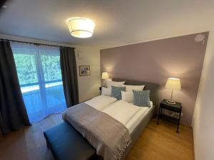 Ένα ή περισσότερα κρεβάτια σε δωμάτιο στο Haus Kleeblatt im Chiemgau +31 φωτογραφίες