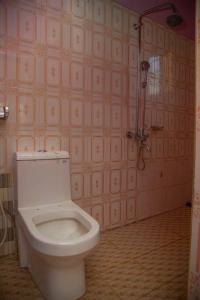 a bathroom with a toilet and a shower at 3 Bedroom Appartment with Beautiful view of Kilimanjaro Mountain in Moshi