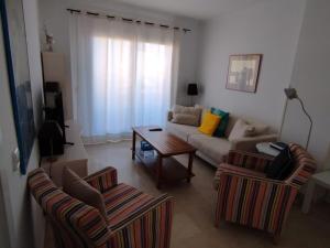 A seating area at Novo Sancti Petri, La Barrosa, 2 Beds Room Apartamento by Chiclana Dreams