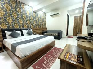 Katil atau katil-katil dalam bilik di HOTEL TAPOVAN IN