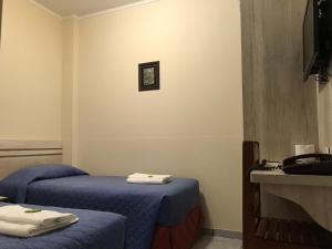 Postel nebo postele na pokoji v ubytování Hotel Colonial + 49 fotografií