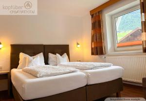 Postel nebo postele na pokoji v ubytování Sporthotel Bergheim