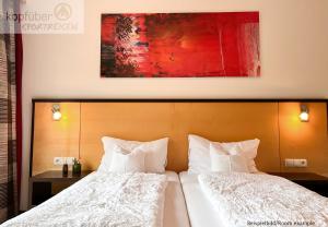 Postel nebo postele na pokoji v ubytování Sporthotel Bergheim