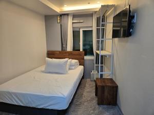 Postel nebo postele na pokoji v ubytování K-Stay Guesthouse Dongdaemun