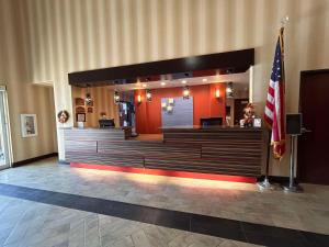a synagogue with an american flag in a room at Express Inn Leesville Ft Johnson, SureStay Collection by Best Western in Leesville