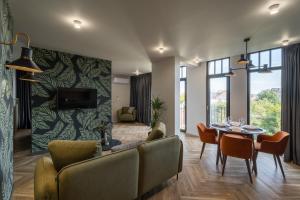 a living room with a couch and a table at Ridge Apartments in Chernivtsi
