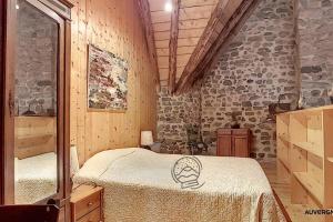 a room with a bed with a skull on it at La Flanerie in Chambon-sur-Lac