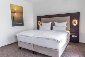 Postel nebo postele na pokoji v ubytování Fontane Hotel