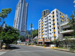 a street with two tall buildings on a city street at Hotel Montreal in Panama City