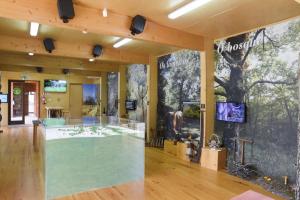 a store with a large display case in a room at Casa do Planalto Mirandês in Miranda do Douro
