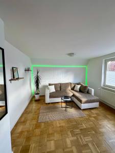 a living room with a couch and a table at Casa Corina in Norden