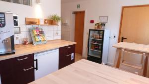 Η κουζίνα ή μικρή κουζίνα στο boardinghouse Kappeln by team SchleiFee +10 φωτογραφίες