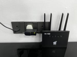 a computer system with a mouse and a box at raub homesty in Kampong Sempalit Hilir