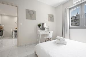 Posteľ alebo postele v izbe v ubytovaní Aelia Apartments, The Luxury Suites