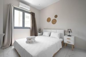 Posteľ alebo postele v izbe v ubytovaní Aelia Apartments, The Luxury Suites