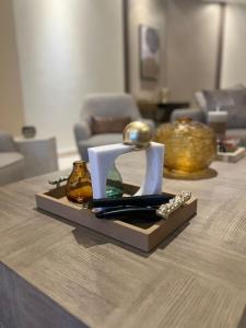 a table with some items on top of it at أبحر ريزيدينس804 in Obhor