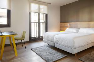Postel nebo postele na pokoji v ubytování Hotel Imaz