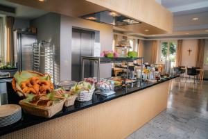 a buffet line in a hotel with food on it at Hotel Haus Schönstatt contactless-Check-In in Brig