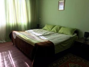 Postel nebo postele na pokoji v ubytování Гостевой дом