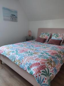 Postel nebo postele na pokoji v ubytování Gîte Bienvenue chez Naty