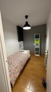 a bedroom with a bed in the corner of a room at La Caseta in Ulldemolins