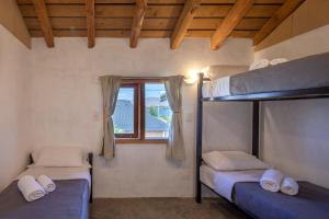 Postel nebo postele na pokoji v ubytování Maneco Hostel