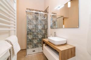 a bathroom with a sink and a shower at Civico 27 in Città della Pieve