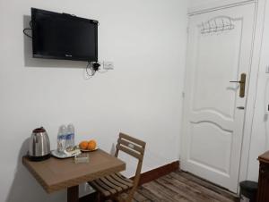 TV a/nebo společenská místnost v ubytování Eyad Pyramids view