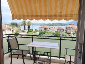 a view from a balcony with a table and chairs at Verde lygia in Lygia