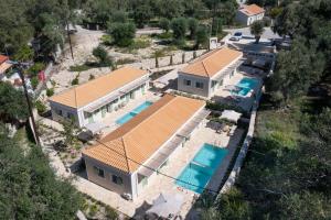 an aerial view of a house with a swimming pool at ULIVETO PAXOS in Velianitátika