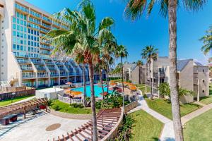 an image of a resort with a pool and palm trees at Solare Garden Villa #773 in South Padre Island