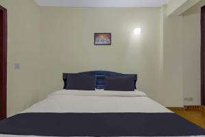 Voodi või voodid majutusasutuse Hotel O Malhotra BnB toas