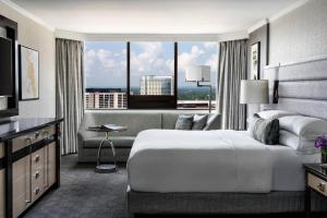 a hotel room with a bed and a large window at The Ritz-Carlton Atlanta in Atlanta