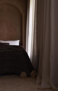 Postel nebo postele na pokoji v ubytování Riad Muarid