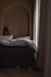 Postel nebo postele na pokoji v ubytování Riad Muarid