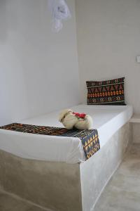 Postel nebo postele na pokoji v ubytování Blooming Zanzibar