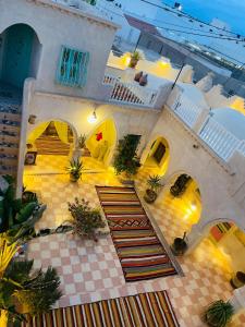 an aerial view of a building with a staircase in a courtyard at Chambre dans une maison d'hôtes in Medenine +9 photos