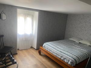 Ένα ή περισσότερα κρεβάτια σε δωμάτιο στο Centre saint malo