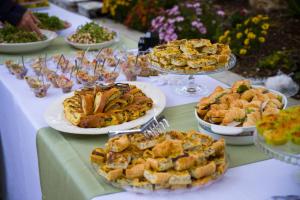 a table with many plates of food on it at Azienda agrituristica Di Fiore in Morcone