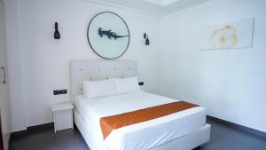 Postel nebo postele na pokoji v ubytování Silver Oasis Maldives