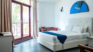 Postel nebo postele na pokoji v ubytování Silver Oasis Maldives